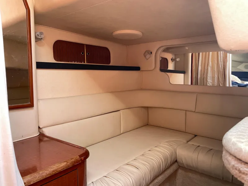 Slide: The Image of Interior cabin of a 2002 Sea Ray 340 Sundancer yacht with beige seating. - 15