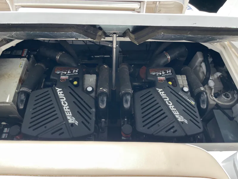 Slide: The Image of Twin Mercury engines in a 2002 Sea Ray 340 Sundancer boat. - 18