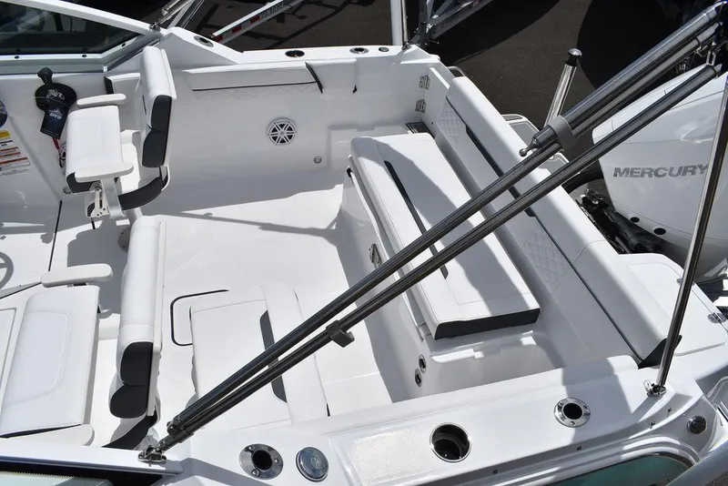 Slide: The Image of 2023 Blackfin 232 DC boat interior with seating and Mercury engine. - 11