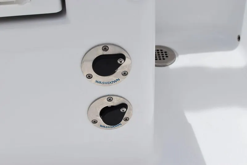 Slide: The Image of 2023 Blackfin 232 DC washdown ports on white boat deck. - 19