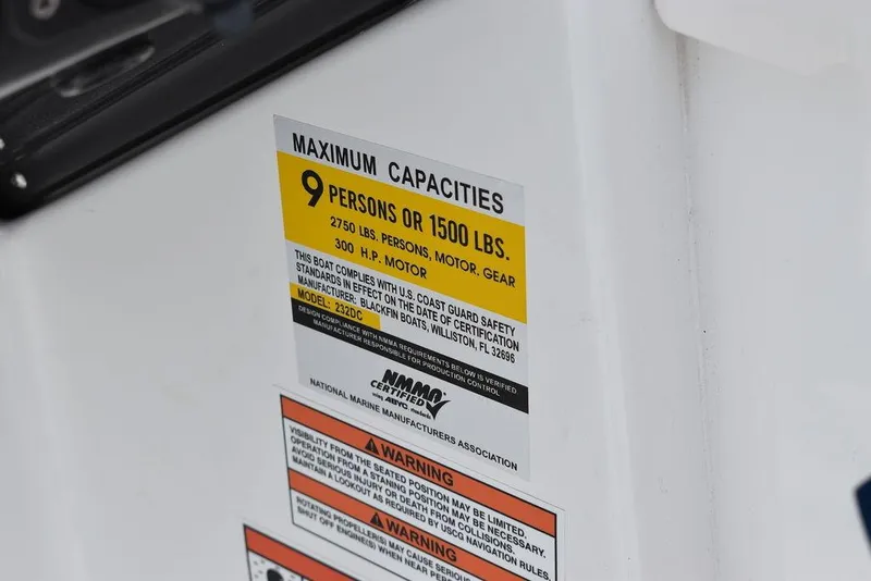 Slide: The Image of 2023 Blackfin 232 DC maximum capacities label, 9 persons or 1500 lbs, 300 HP motor. - 28