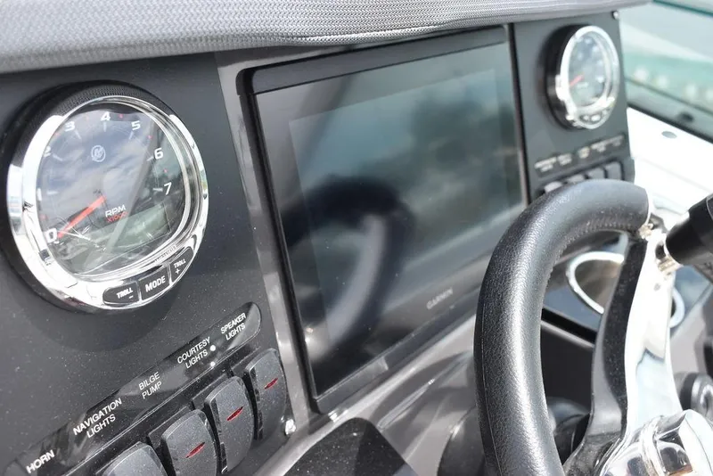 Slide: The Image of 2023 Blackfin 232 DC dashboard with gauges and touchscreen display. - 31