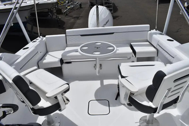 Slide: The Image of 2023 Blackfin 232 DC boat interior with seating and table. - 46