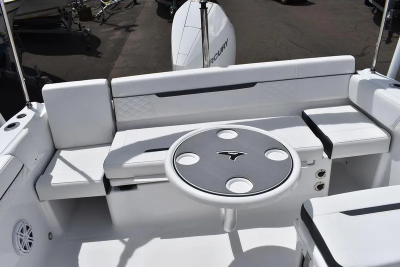 Slide: The Image of 2023 Blackfin 232 DC boat interior with seating and round table. - 48