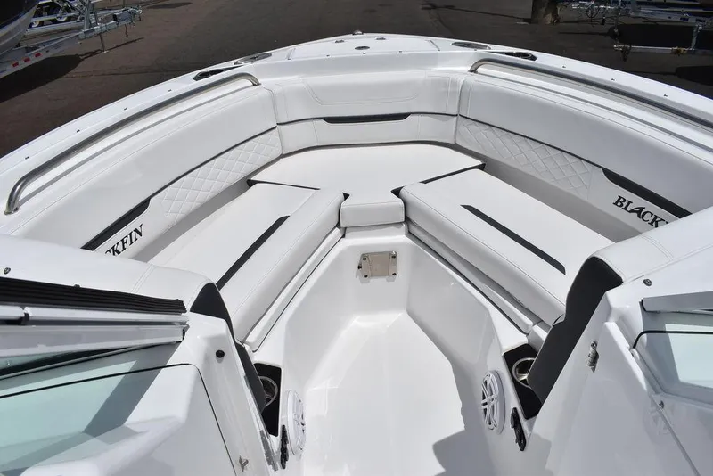 Slide: The Image of 2023 Blackfin 232 DC boat with spacious white seating area. - 49