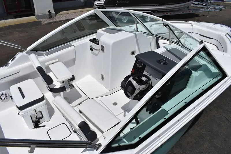 Slide: The Image of 2023 Blackfin 232 DC boat interior with seating and steering console. - 8