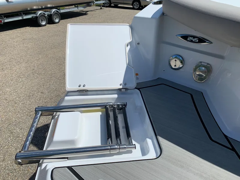 Slide: The Image of 2023 Glastron GTD 245 boat with integrated swim ladder and storage compartment. - 11