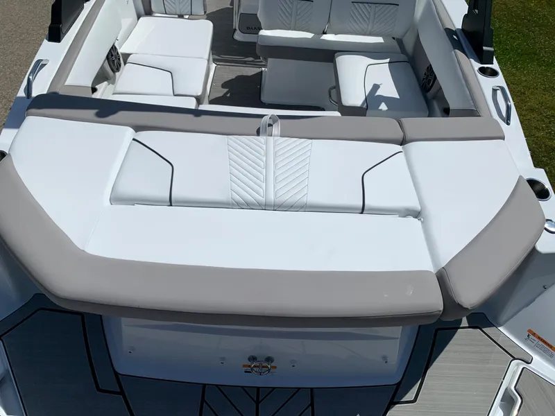 Slide: The Image of 2023 Glastron GTD 245 boat interior with white and gray seating. - 12