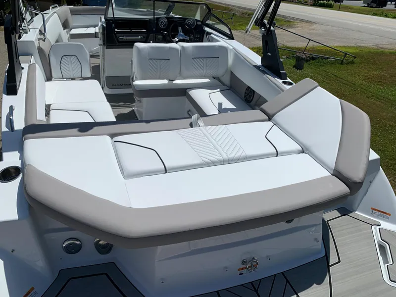 Slide: The Image of 2023 Glastron GTD 245 boat interior with white and beige seating. - 13