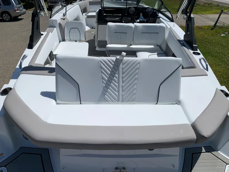 Slide: The Image of 2023 Glastron GTD 245 boat interior with white and gray seating. - 14