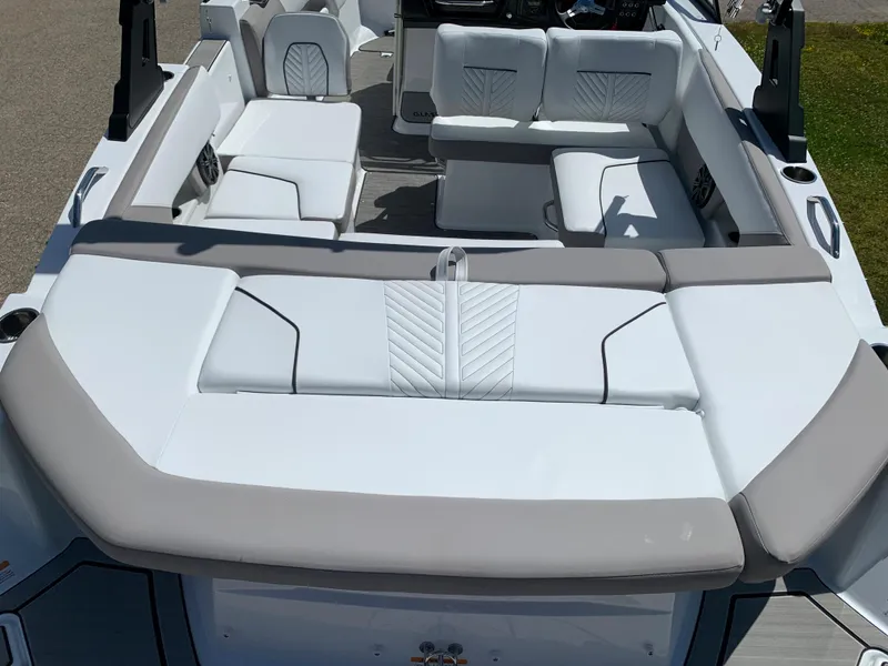 Slide: The Image of 2023 Glastron GTD 245 boat interior with white and gray seating. - 15