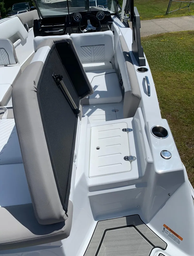 Slide: The Image of 2023 Glastron GTD 245 boat interior with seating and storage compartments. - 17
