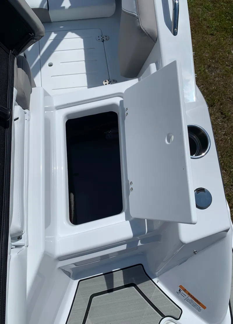 Slide: The Image of 2023 Glastron GTD 245 boat with open storage compartment. - 19