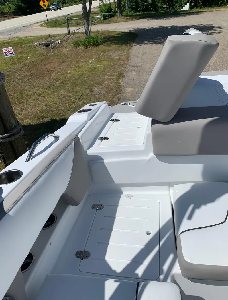 Slide: The Image of 2023 Glastron GTD 245 boat interior with white and gray seating. - 20