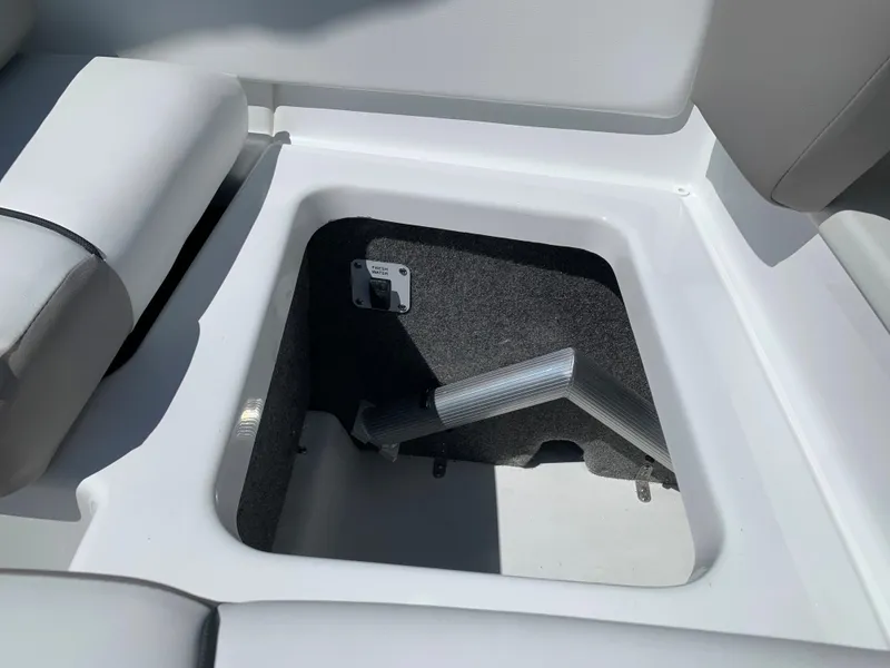 Slide: The Image of 2023 Glastron GTD 245 storage compartment with cushioned seating. - 30