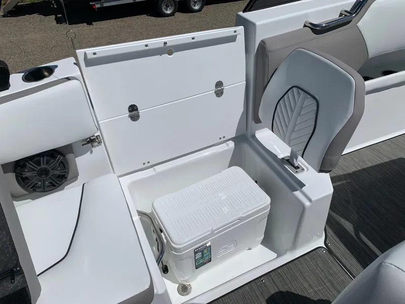 Slide: The Image of 2023 Glastron GTD 245 boat interior with storage compartment and cooler. - 33