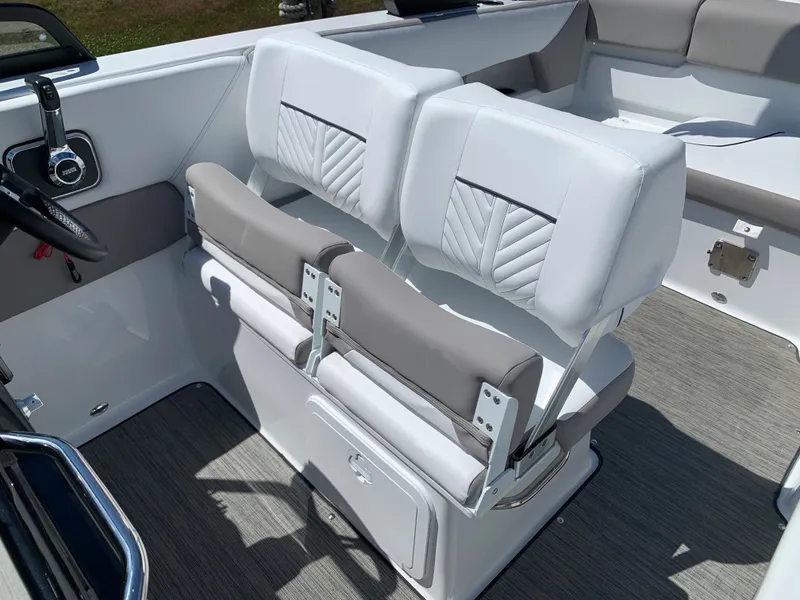 Slide: The Image of 2023 Glastron GTD 245 boat interior with dual white and gray seats. - 44