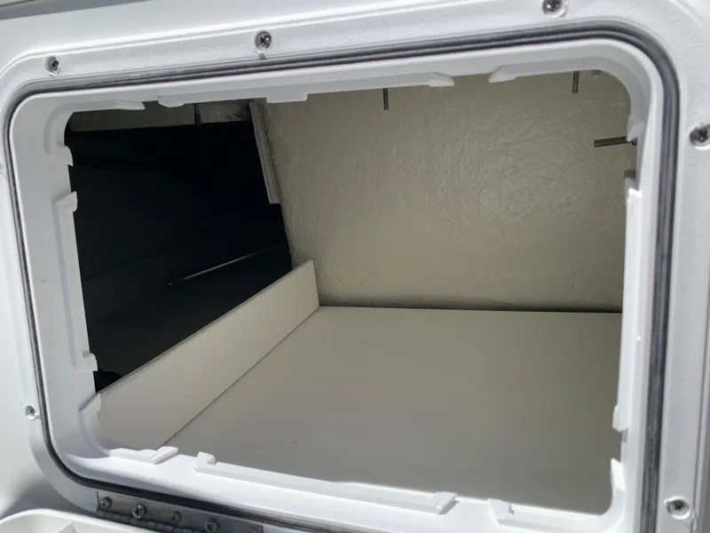Slide: The Image of 2023 Glastron GTD 245 storage compartment. - 46