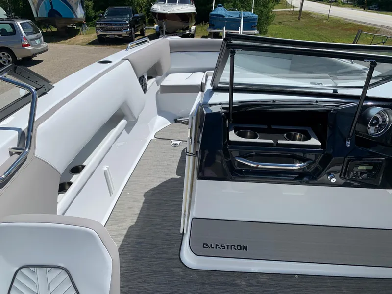 Slide: The Image of 2023 Glastron GTD 245 boat interior with seating and dashboard. - 47