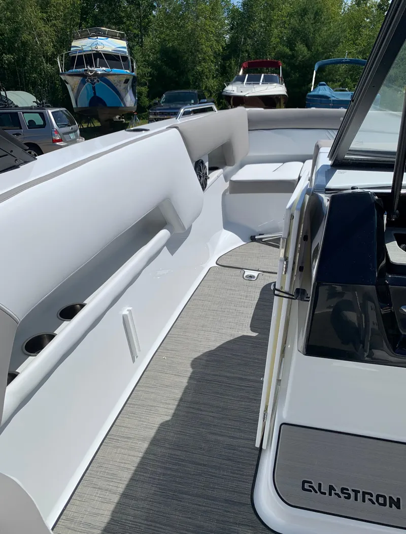 Slide: The Image of 2023 Glastron GTD 245 boat interior with seating and deck view. - 49