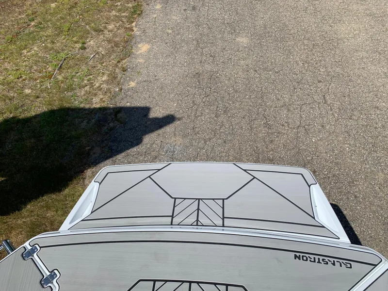 Slide: The Image of 2023 Glastron GTD 245 boat on a paved surface, top view. - 7
