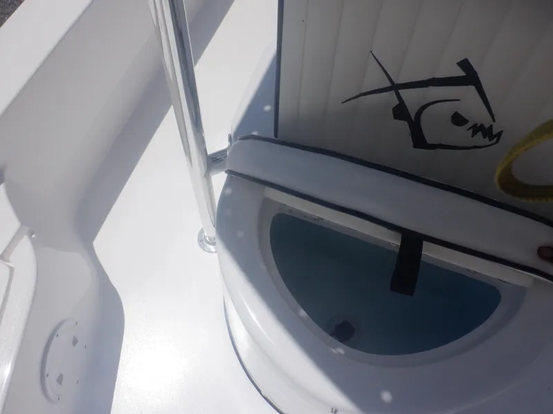 Slide: The Image of Piranha Casador B2200 2023 boat interior with storage compartment and fish logo. - 13