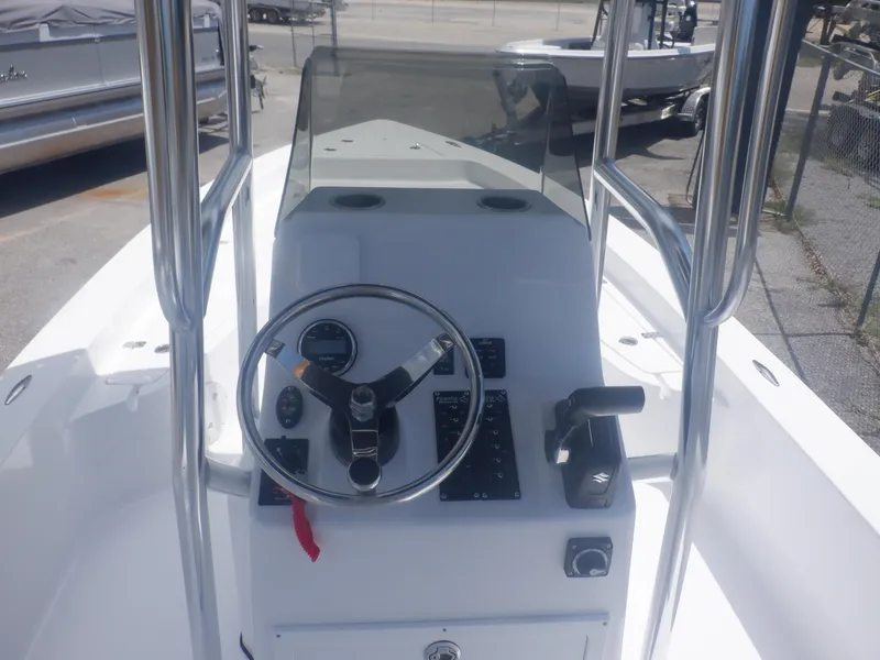 Slide: The Image of 2023 Piranha Casador B2200 boat console with steering wheel and controls. - 2
