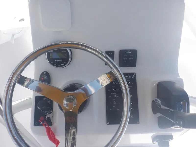Slide: The Image of Steering console of 2023 Piranha Casador B2200 boat with controls and gauges. - 3