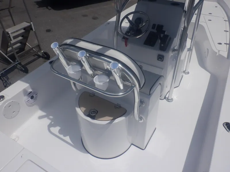 Slide: The Image of 2023 Piranha Casador B2200 boat interior with steering console and rod holders. - 7