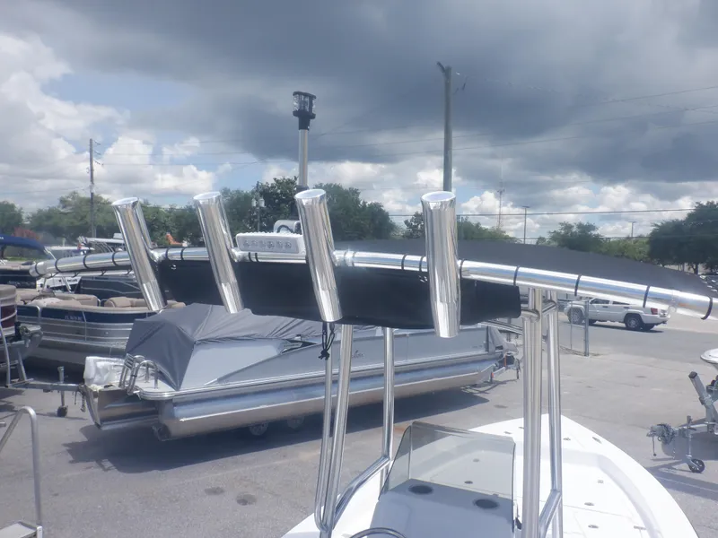 Slide: The Image of 2023 Piranha Casador B2200 boat with rod holders in a marina. - 8