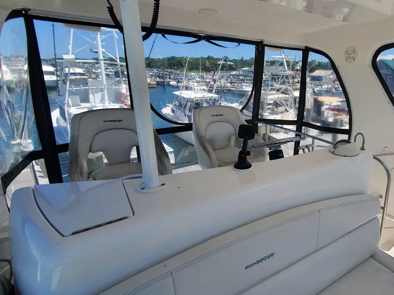 Slide: The Image of 2003 Silverton 38 Convertible yacht interior with marina view. - 14