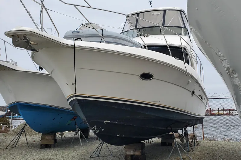 Slide: The Image of 2003 Silverton 38 Convertible yacht on dry dock, side view. - 29