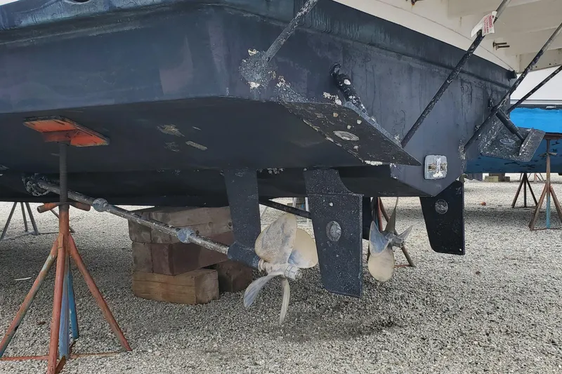 Slide: The Image of 2003 Silverton 38 Convertible boat hull and propellers on dry dock. - 30