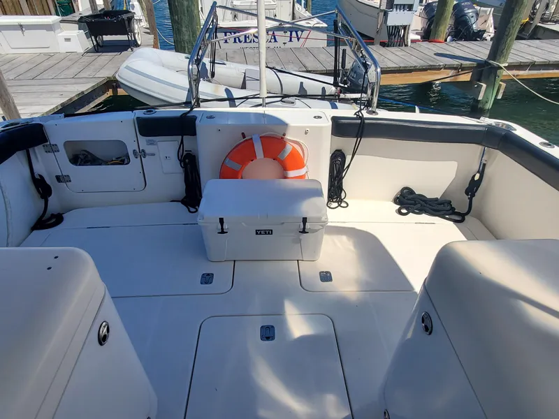 Slide: The Image of 2003 Silverton 38 Convertible boat deck with life preserver and dock view. - 8