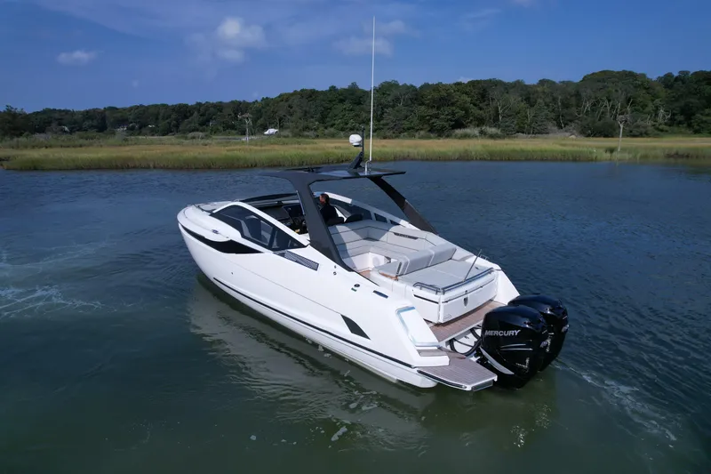 The Image of 2023 Fairline F//Line 33 Outboard luxury yacht on calm water. - 0