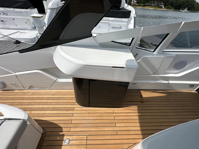 Slide: The Image of 2023 Fairline F//Line 33 Outboard yacht with open kitchenette and mini-fridge on deck. - 12