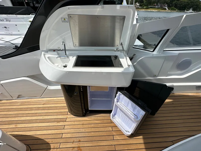 Slide: The Image of Storage compartment on 2023 Fairline F//Line 33 Outboard with ropes and equipment. - 14
