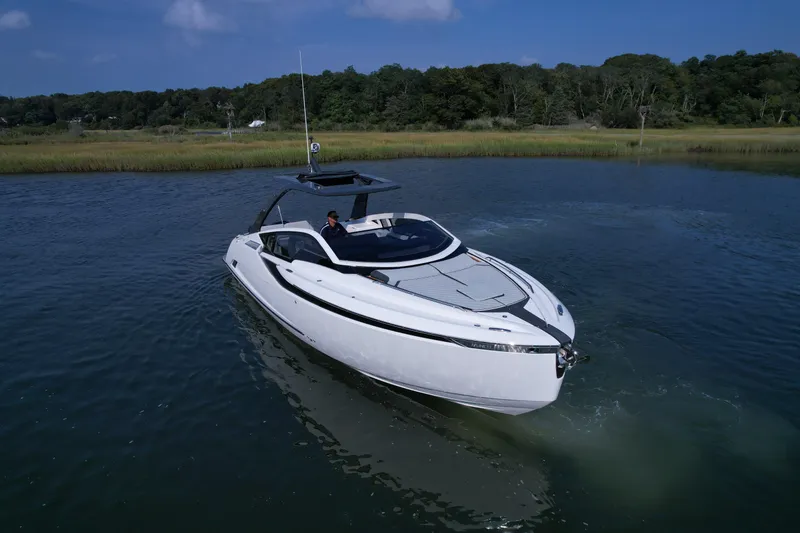 Slide: The Image of 2023 Fairline F//Line 33 Outboard luxury motor yacht on calm water. - 3