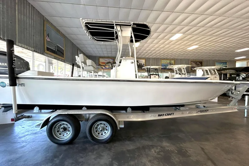 Slide: The Image of 2023 May-Craft 260 Bay boat on trailer in showroom, side view. - 13