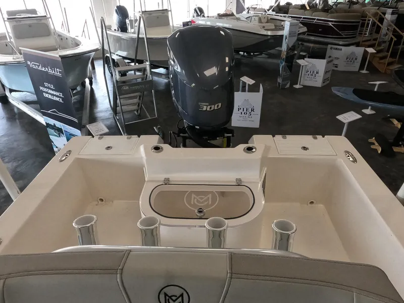 Slide: The Image of 2023 May-Craft 260 Bay boat with 300 HP engine at a boat show. - 3