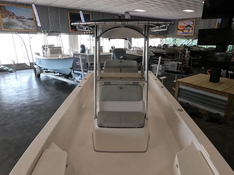 Slide: The Image of 2023 May-Craft 260 Bay boat on display in a showroom. - 6