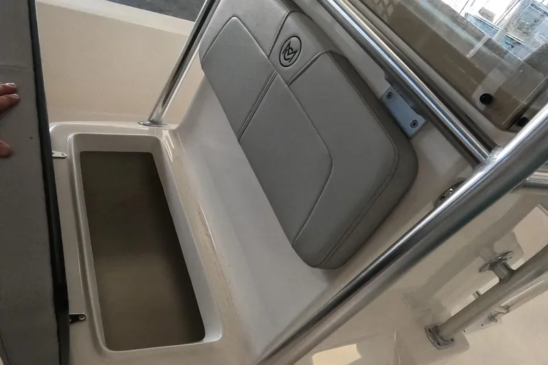 Slide: The Image of 2023 May-Craft 260 Bay boat interior seating and storage compartment. - 7
