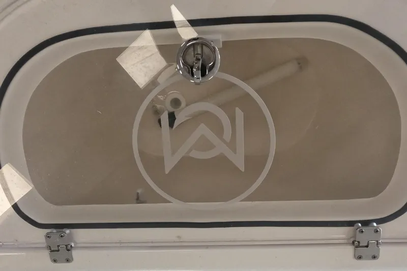 Slide: The Image of 2023 May-Craft 260 Bay boat compartment with transparent cover and latch. - 8