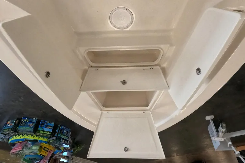 Slide: The Image of 2023 May-Craft 260 Bay boat storage compartments. - 9