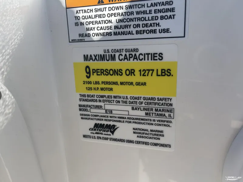 Slide: The Image of Bayliner E18 2022 capacity label: 9 persons, 1277 lbs, 125 HP motor. - 9