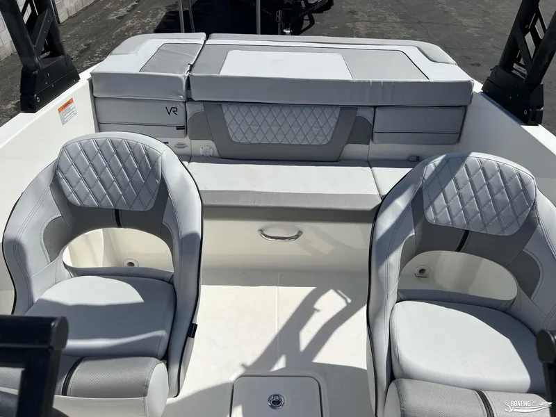 Slide: The Image of 2023 Bayliner VR6 Outboard boat interior with gray seating and diamond stitching. - 10