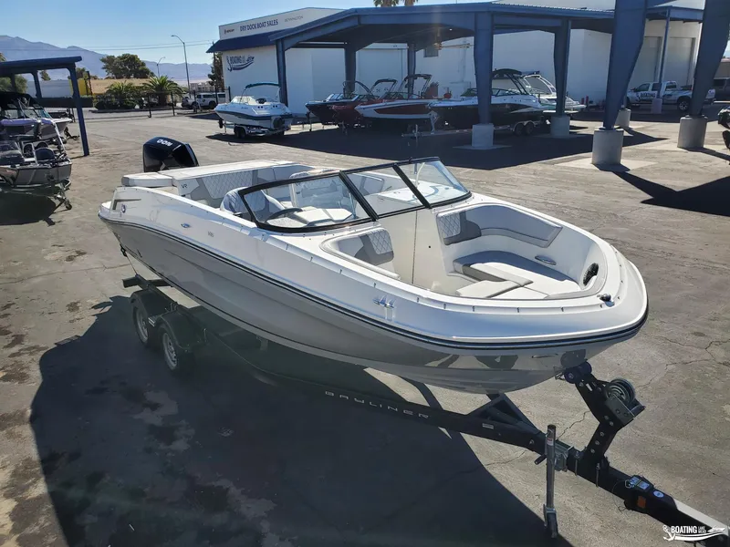 Slide: The Image of 2023 Bayliner VR6 Outboard boat on trailer at dealership. - 2