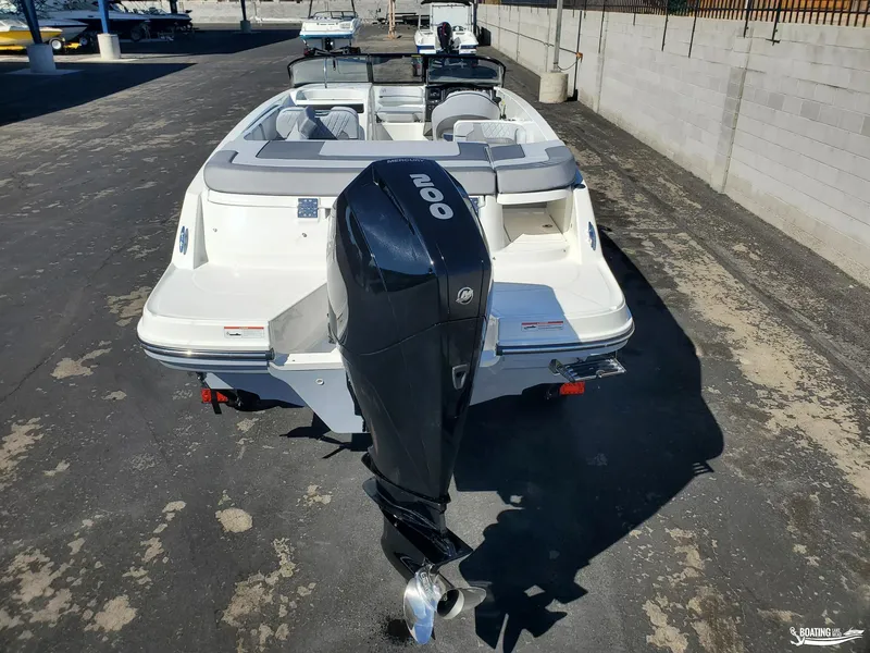 Slide: The Image of 2023 Bayliner VR6 Outboard boat with Mercury engine, parked on pavement. - 6