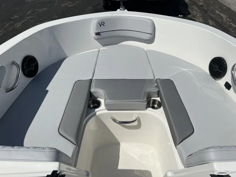Slide: The Image of 2023 Bayliner VR6 Outboard boat interior with gray seating and cup holders. - 8
