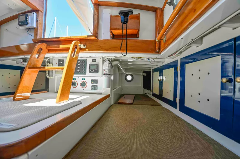 Slide: The Image of Interior of 1927 Schock Staysail Schooner with wooden accents and nautical equipment. - 12